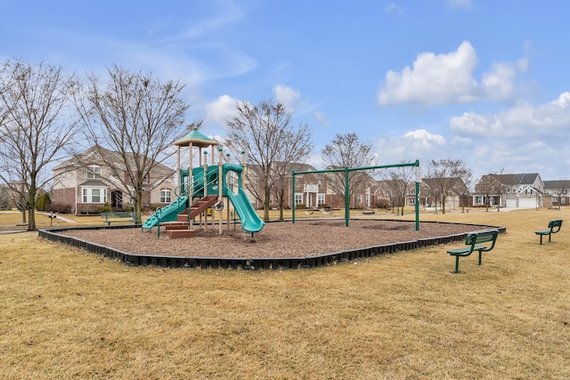 communal playground featuring a lawn