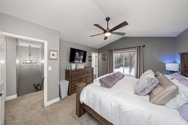 bedroom featuring vaulted ceiling, ceiling fan with notable chandelier, baseboards, and light colored carpet