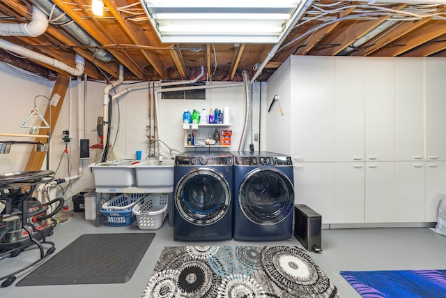 clothes washing area featuring laundry area and washing machine and clothes dryer