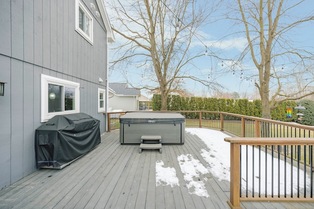 wooden terrace featuring area for grilling and a hot tub