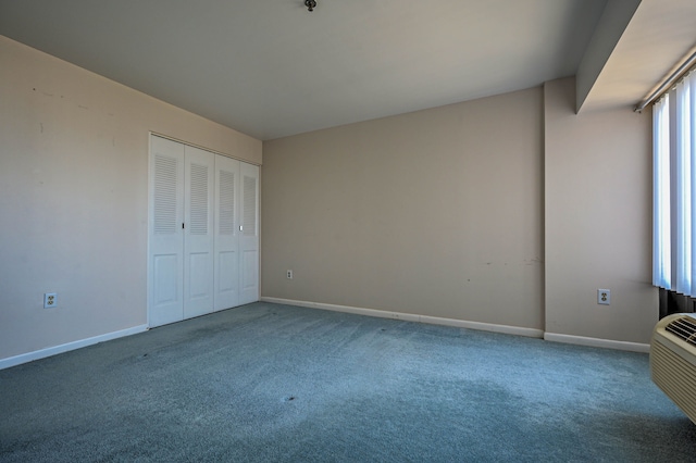 unfurnished bedroom featuring carpet floors, a closet, and baseboards