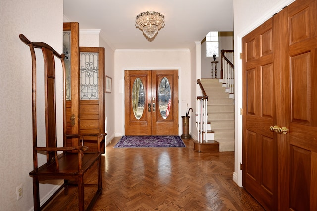 foyer with stairway, french doors, baseboards, and ornamental molding