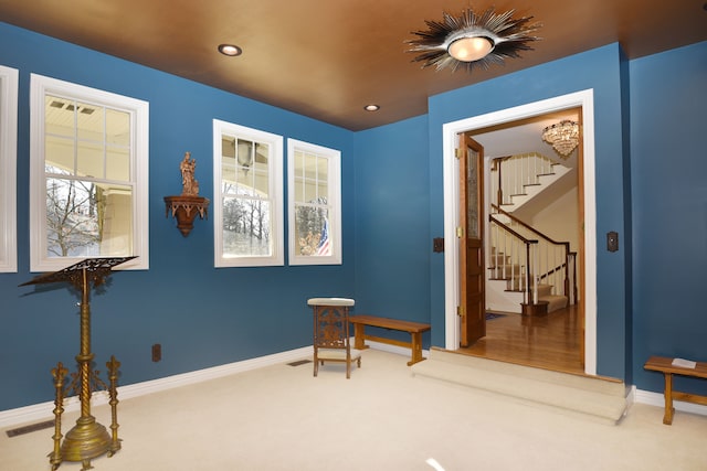 sitting room featuring stairs, recessed lighting, baseboards, and carpet floors