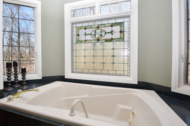 bathroom with a whirlpool tub