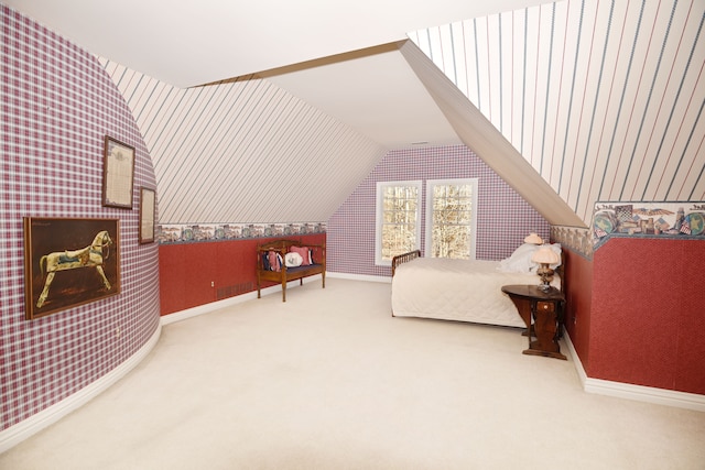 bedroom with baseboards, lofted ceiling, carpet, and wallpapered walls