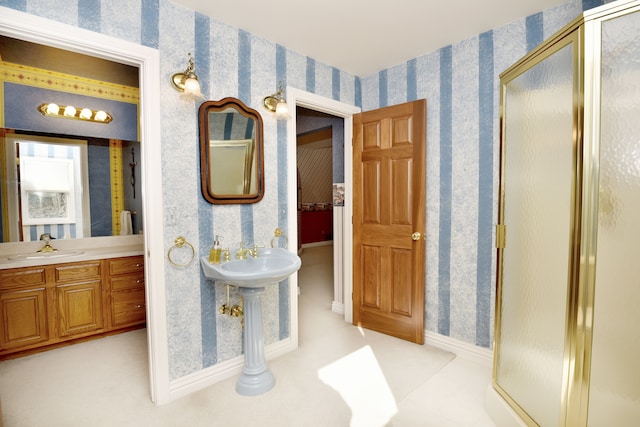 full bath with baseboards, a stall shower, and wallpapered walls