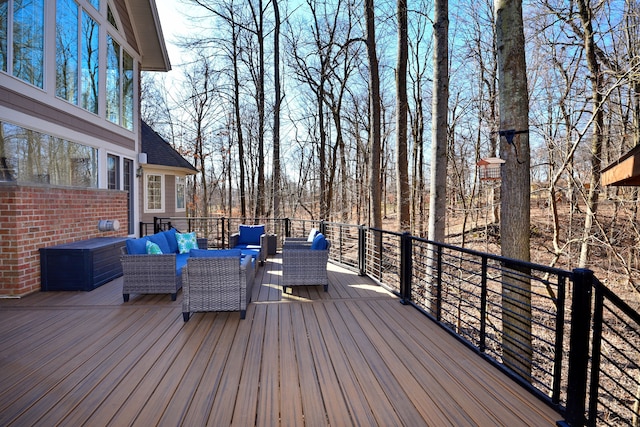 wooden terrace featuring an outdoor hangout area