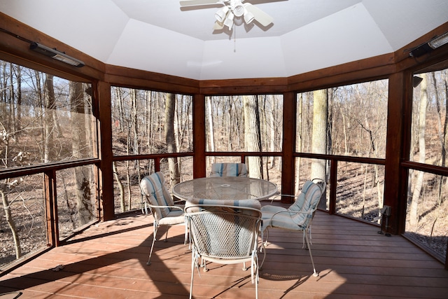 sunroom with a ceiling fan and vaulted ceiling