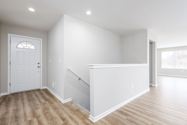 entrance foyer featuring light wood-type flooring, baseboards, and recessed lighting