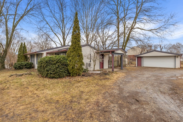 24235 Glenda St, Novi, MI 48375 - view of front of house featuring a garage and an outbuilding