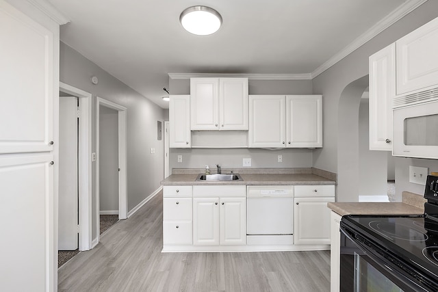 kitchen featuring white appliances, a sink, white cabinets, and light wood-style floors