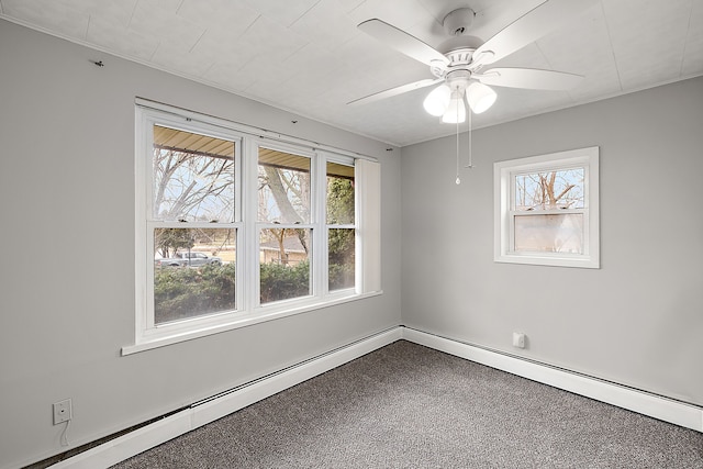 empty room with baseboards, baseboard heating, and a ceiling fan