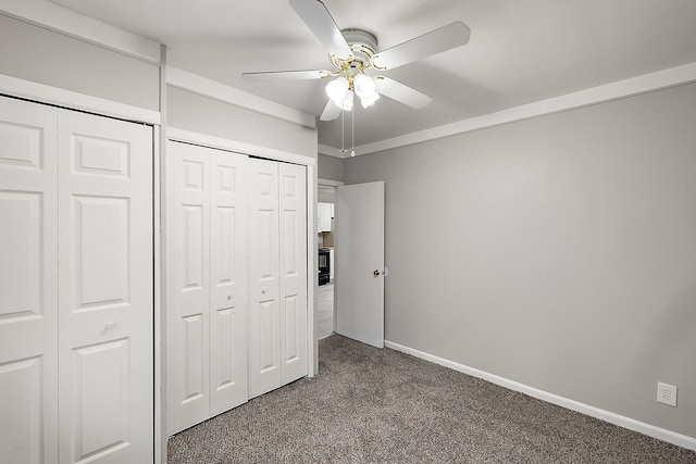 unfurnished bedroom featuring carpet flooring, ceiling fan, and baseboards