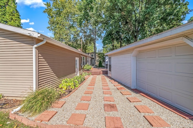 view of side of property with a garage