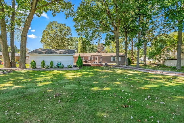 exterior space featuring a wooden deck and a front lawn