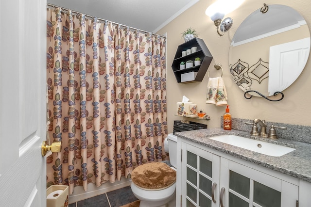 bathroom featuring toilet, vanity, ornamental molding, and tile patterned floors