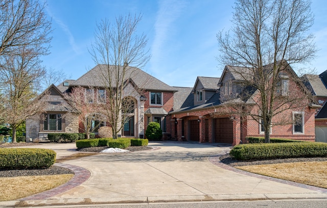 view of front of home featuring brick siding, concrete driveway, and a garage