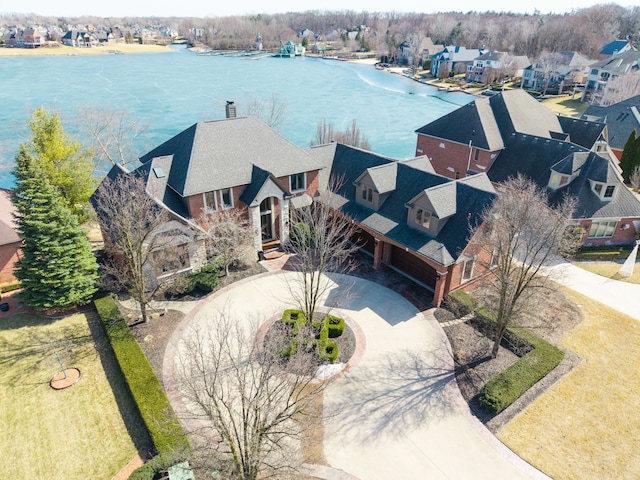 bird's eye view featuring a residential view and a water view