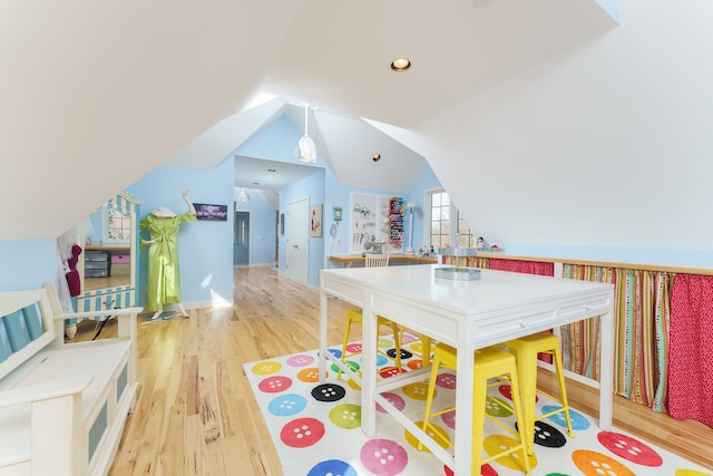 playroom with lofted ceiling, recessed lighting, wood finished floors, and baseboards