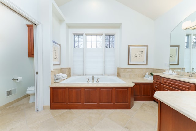 full bathroom featuring visible vents, lofted ceiling, tile patterned flooring, a garden tub, and toilet