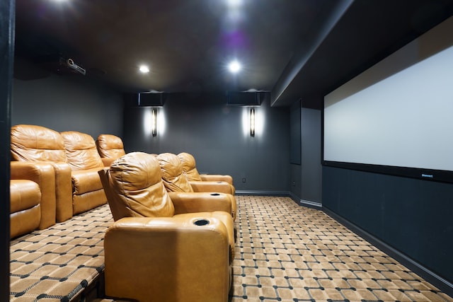 cinema with recessed lighting and baseboards