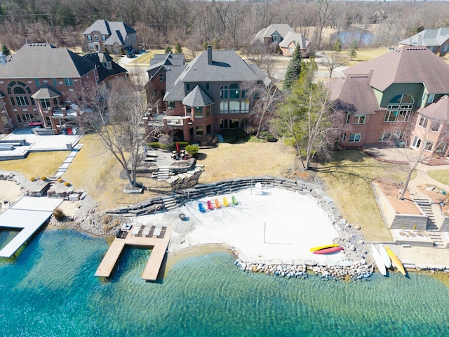 bird's eye view with a residential view and a water view