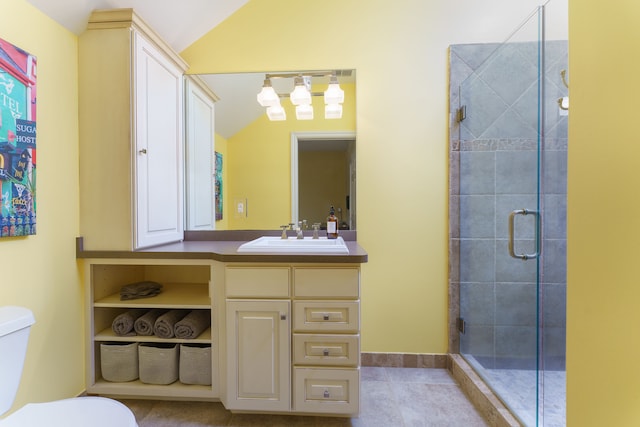 full bathroom with toilet, lofted ceiling, a stall shower, tile patterned floors, and vanity