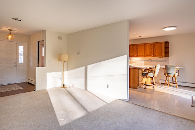 interior space featuring recessed lighting, visible vents, and baseboard heating