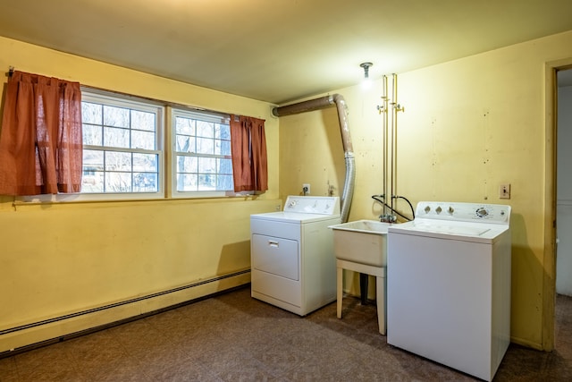 laundry area with washer and dryer, laundry area, tile patterned floors, and baseboard heating