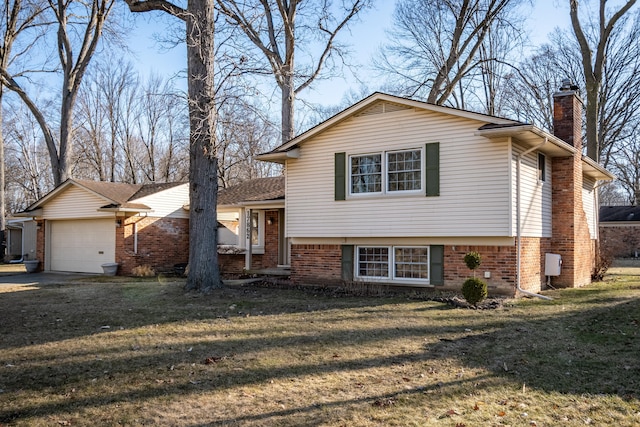 tri-level home featuring a front lawn, a chimney, and a garage