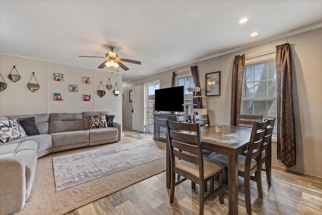 dining area featuring ornamental molding, light wood-type flooring, ceiling fan, and recessed lighting