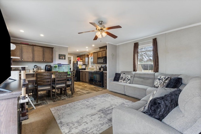 living area featuring ceiling fan, ornamental molding, and recessed lighting