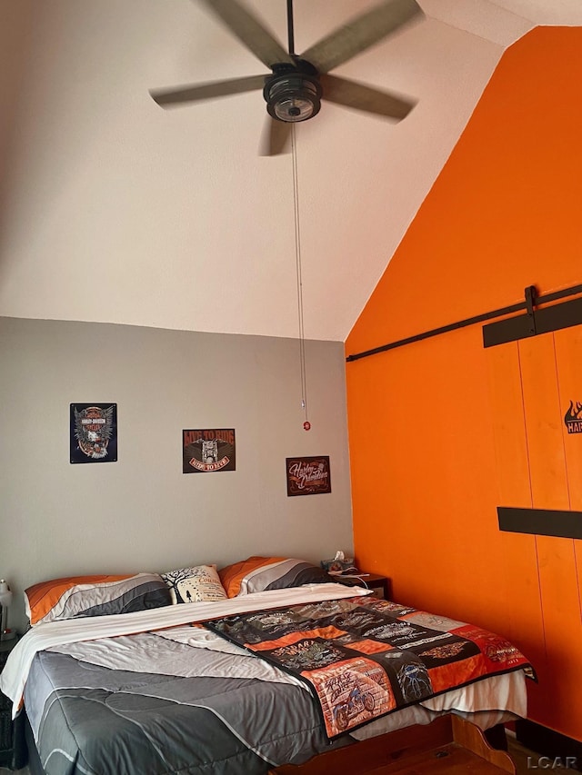 bedroom with lofted ceiling and ceiling fan