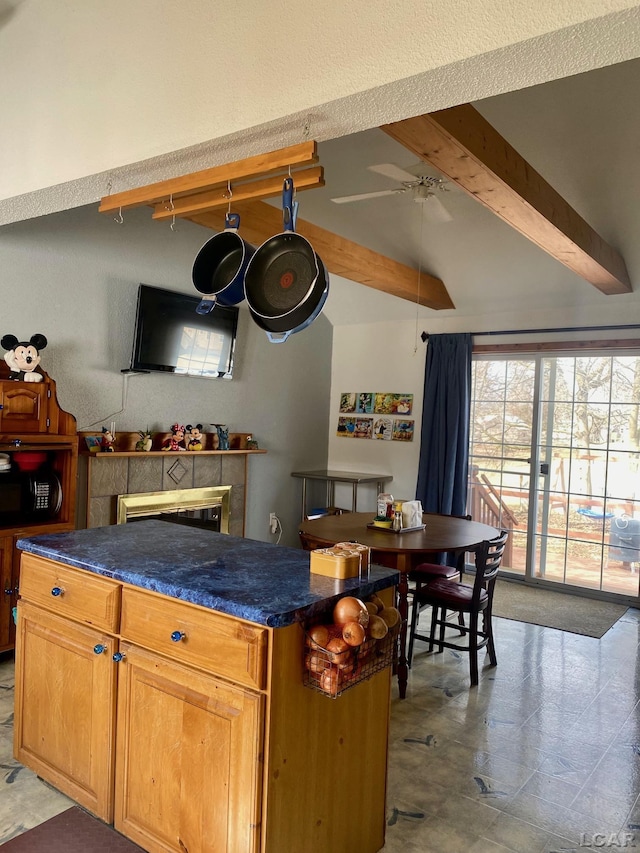 bar featuring lofted ceiling with beams, ceiling fan, and black microwave