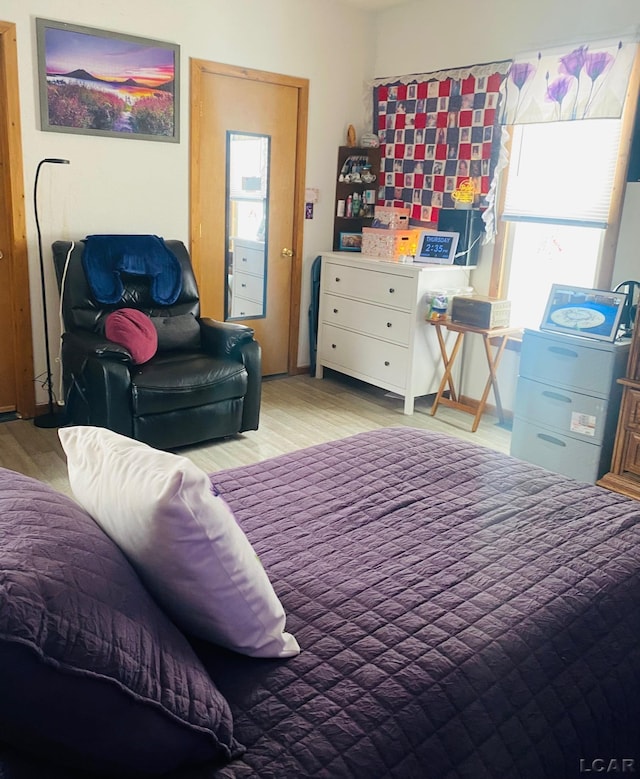 bedroom featuring light wood-style floors