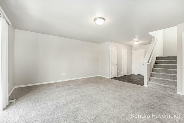 interior space with carpet, baseboards, and stairs