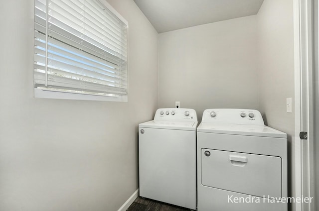 washroom with dark wood-style floors, laundry area, washer and clothes dryer, and baseboards