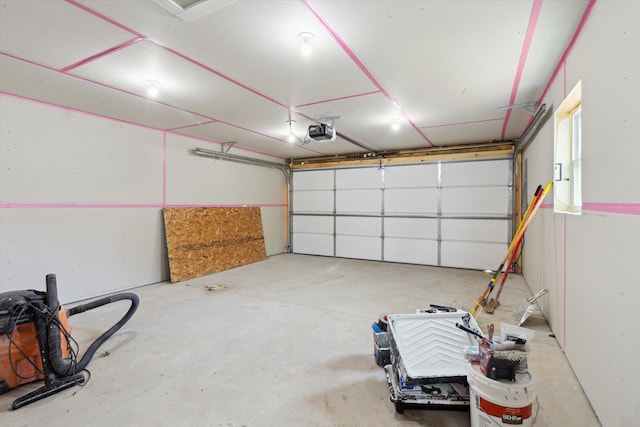 706 Colfax St, Cadillac, MI 49601 - garage featuring a garage door opener