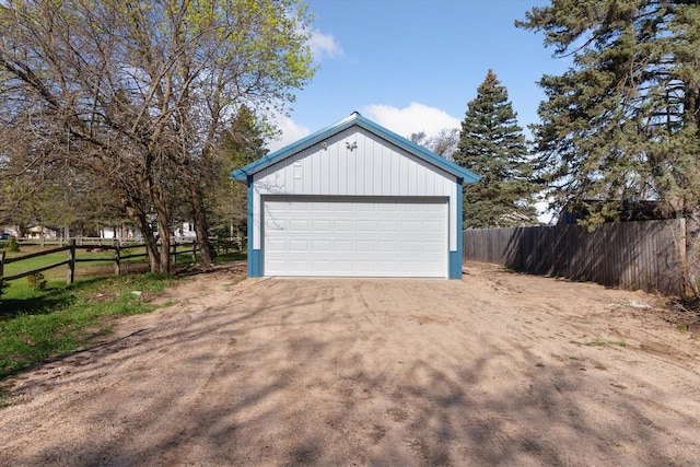 706 Colfax St, Cadillac, MI 49601 - detached garage featuring fence