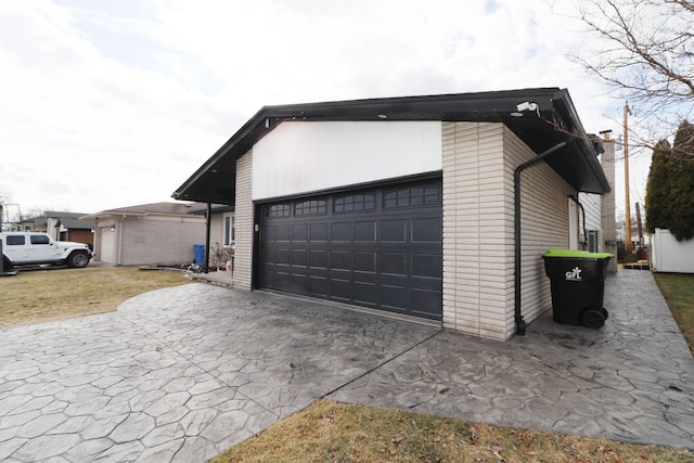 garage featuring driveway