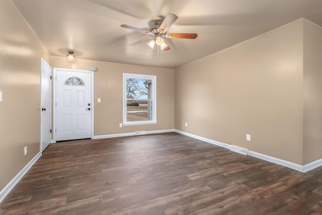 entrance foyer with dark wood-style floors, visible vents, ceiling fan, and baseboards