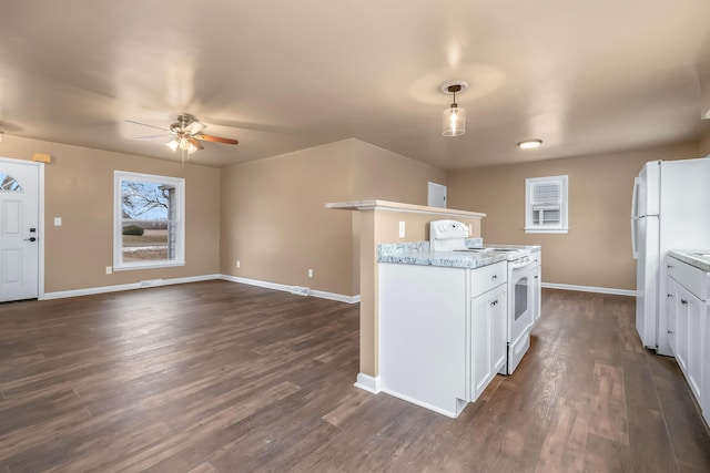 kitchen featuring white appliances, baseboards, and dark wood-type flooring