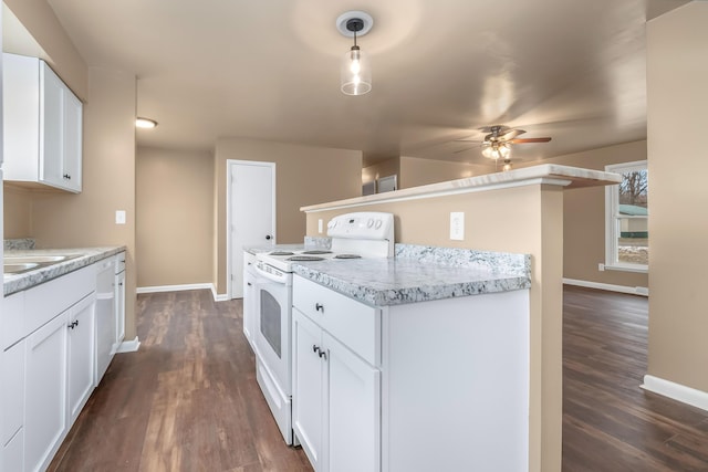 kitchen featuring white appliances, white cabinets, baseboards, and dark wood-style flooring