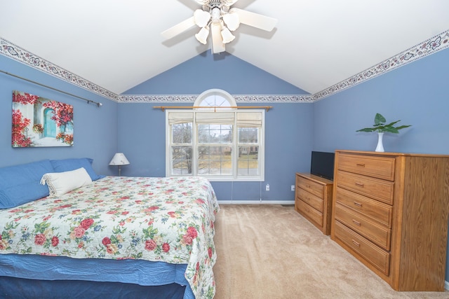 bedroom featuring ceiling fan, baseboards, vaulted ceiling, and light colored carpet