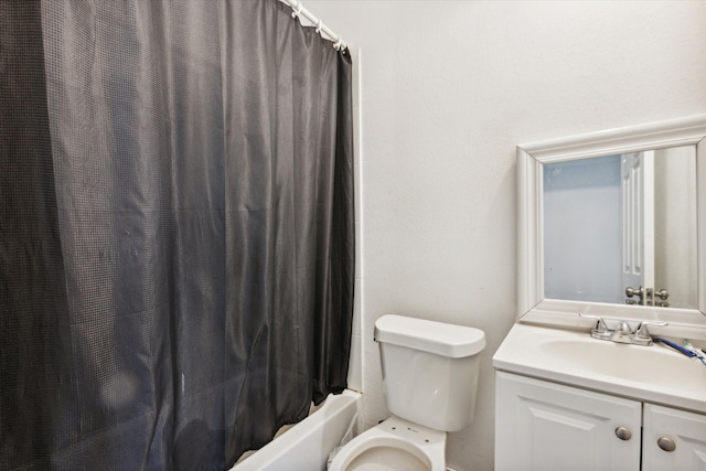 bathroom with vanity, toilet, and shower / bath combo with shower curtain