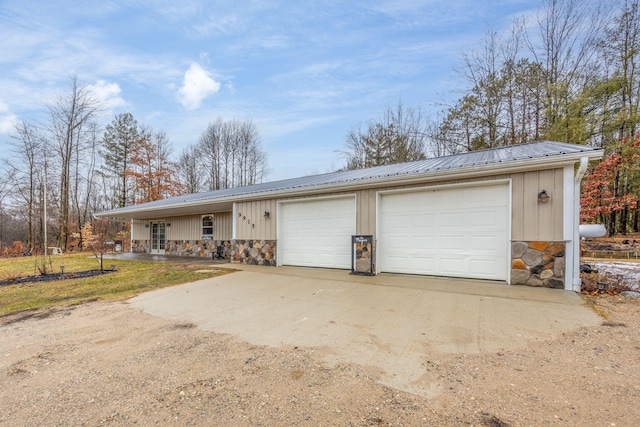 9915 85th Ave, Mecosta, MI 49332 - single story home with board and batten siding, metal roof, and stone siding