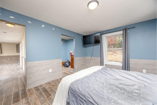 9915 85th Ave, Mecosta, MI 49332 - bedroom featuring wood finished floors and a closet