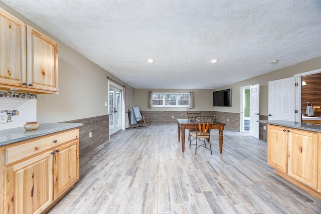 9915 85th Ave, Mecosta, MI 49332 - kitchen with light brown cabinetry, recessed lighting, a textured ceiling, a wainscoted wall, and light wood-style flooring