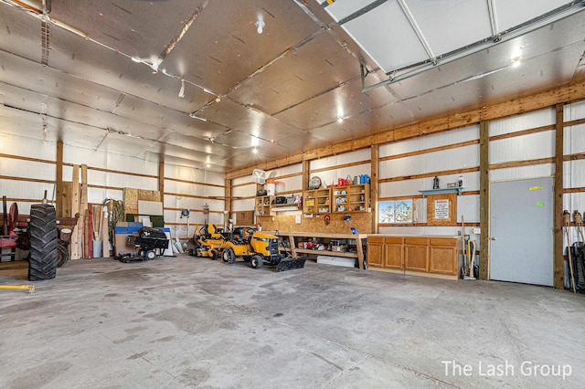 garage with metal wall and a workshop area