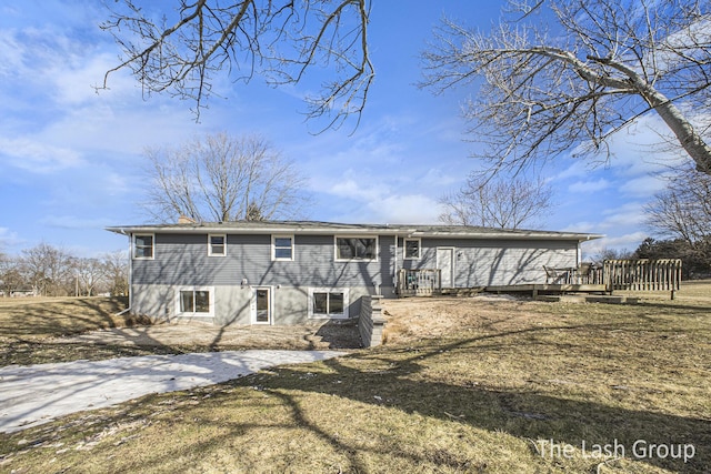 back of house with a wooden deck